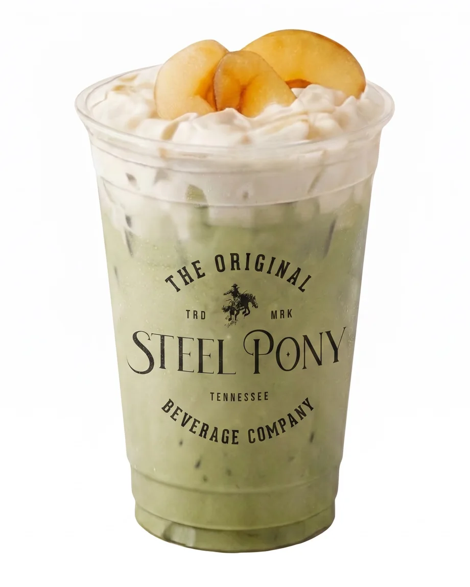 A Steel Pony peach matcha latte topped with fresh peach